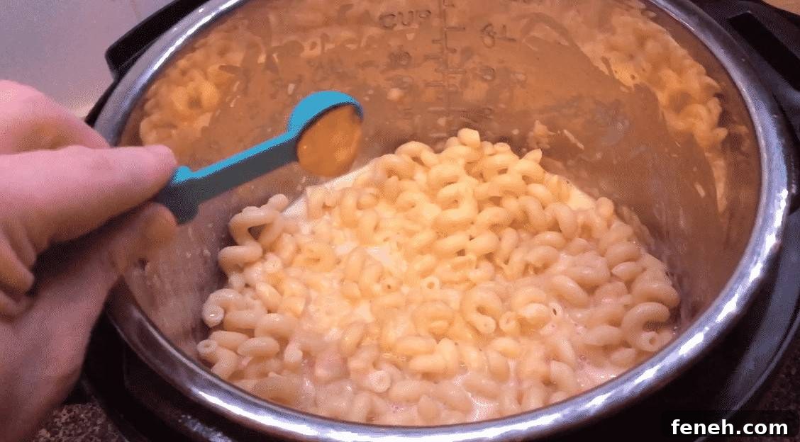 Adding mustard to enhance cheese sauce