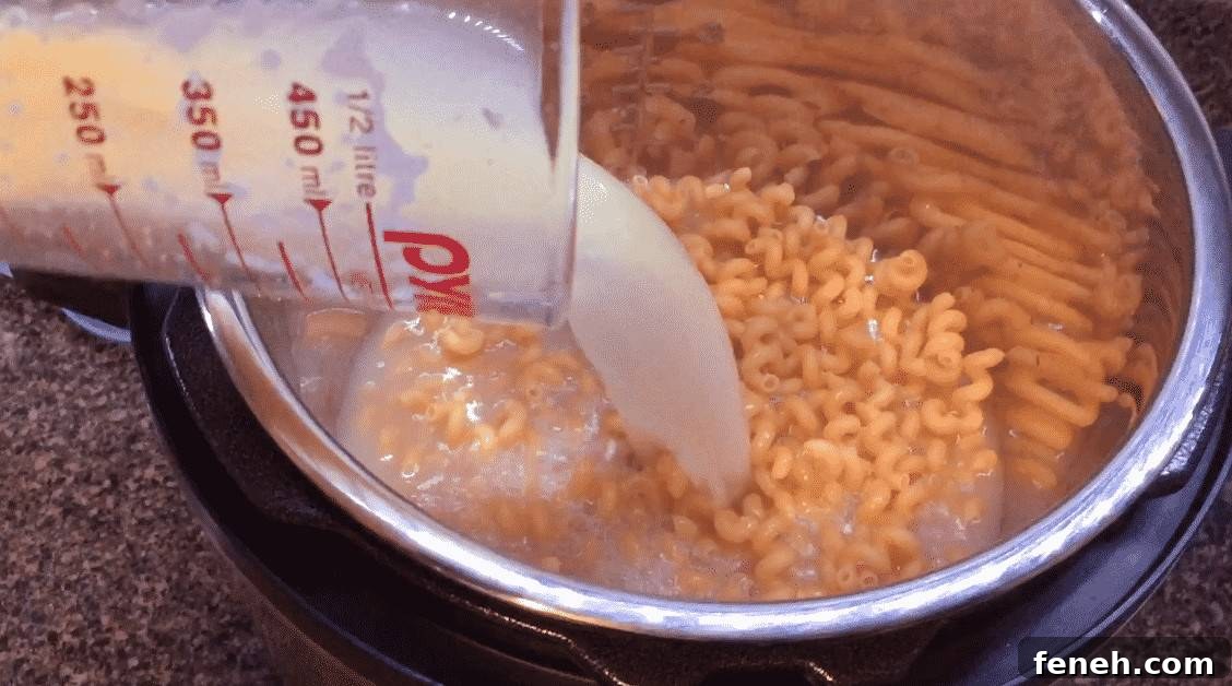 Pouring broth into the Instant Pot