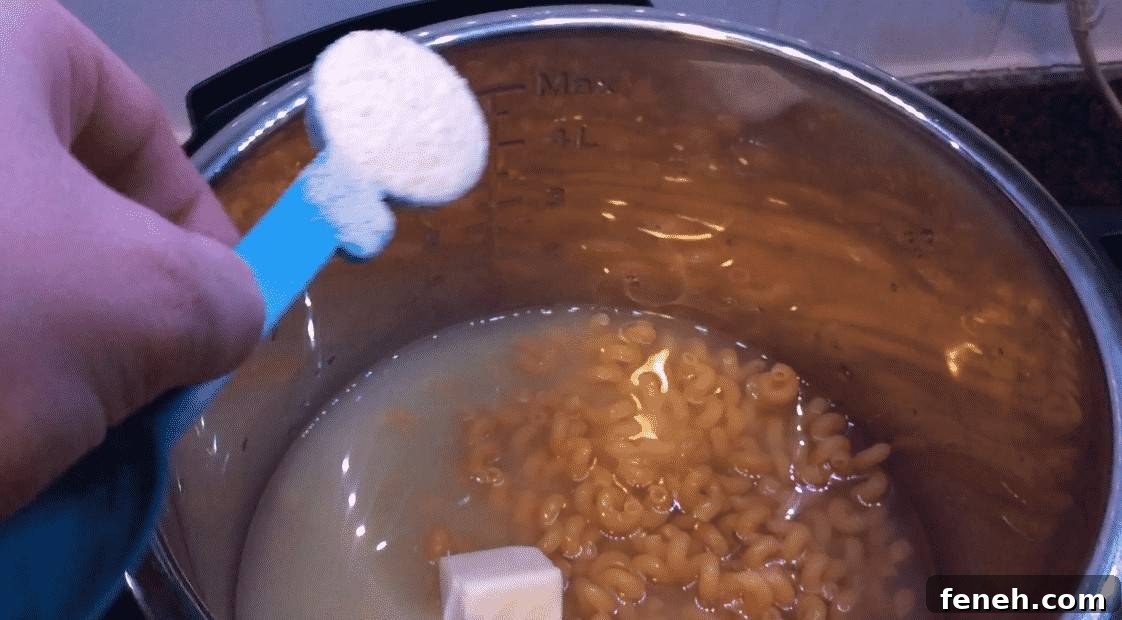 Adding Parmesan cheese to pasta