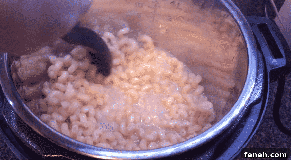Stirring cooked pasta in the Instant Pot