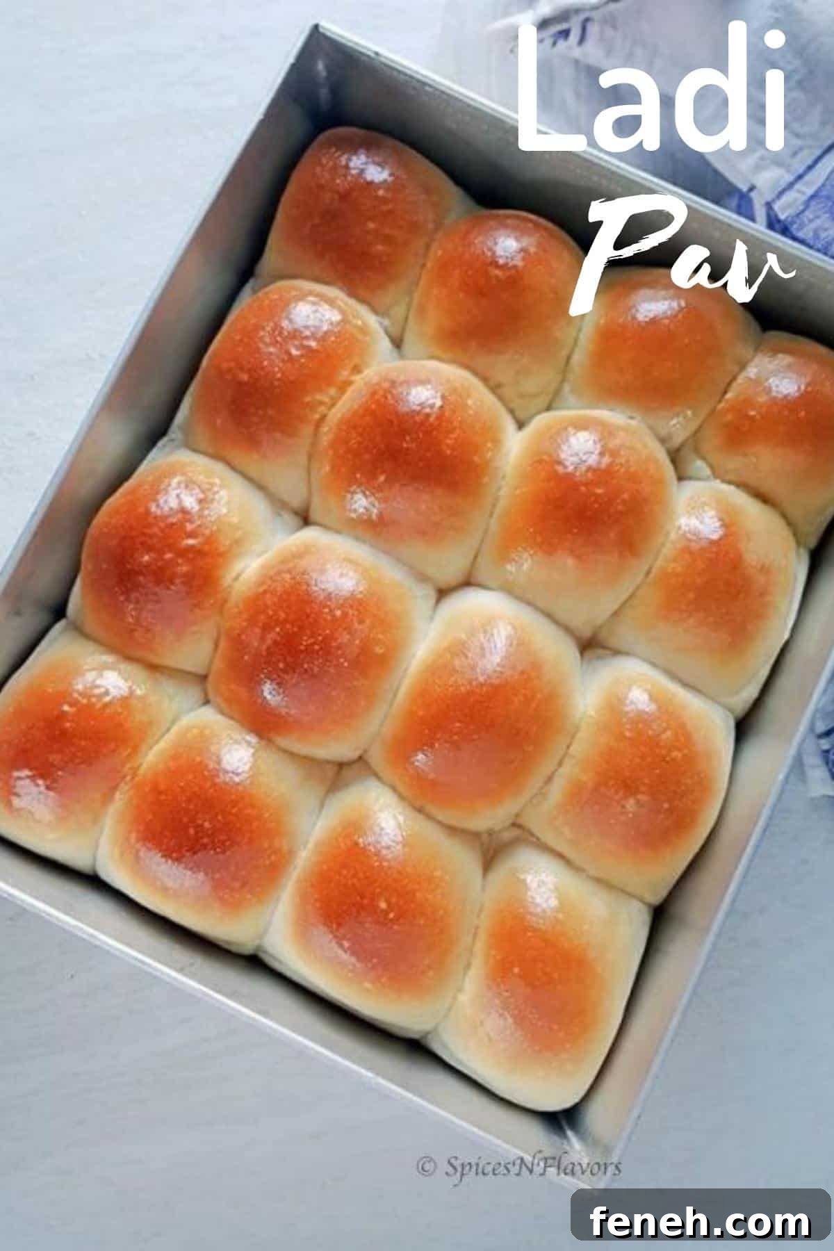 Ladi Pav (Eggless Soft Dinner Rolls) Recipe 2 baked pavs placed in the baking tray