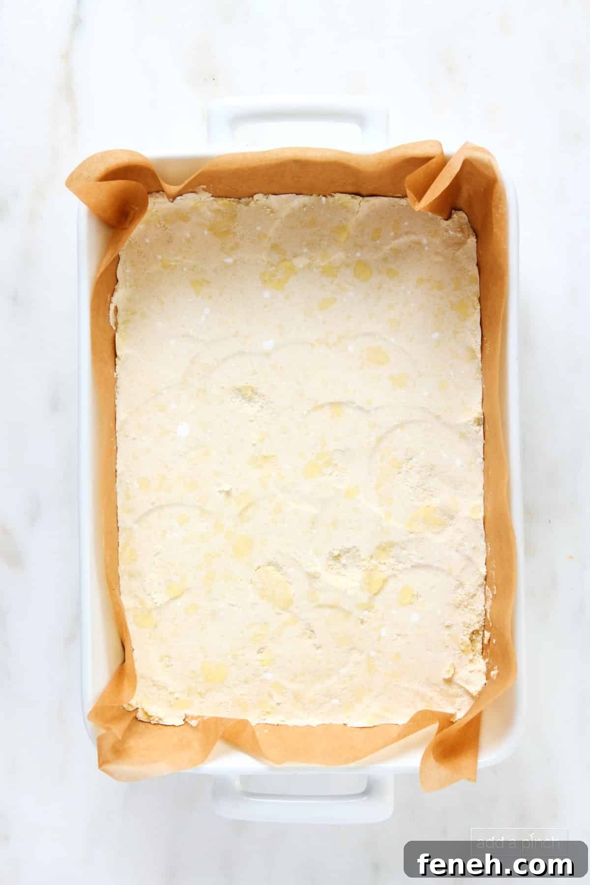 Shortbread crust in a 9x13 baking dish.