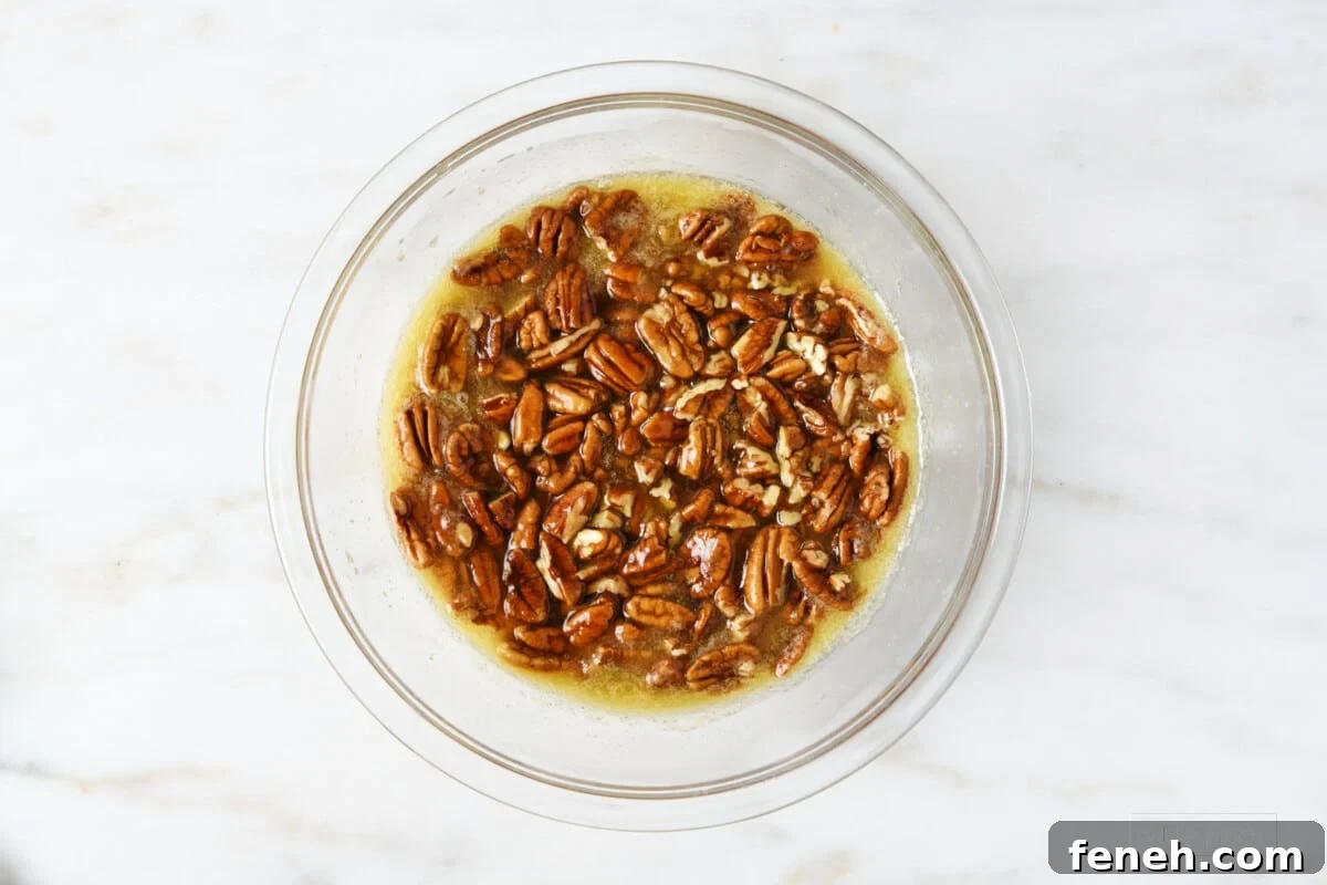 Ingredients for pecan pie bar filling in a glass mixing bowl.