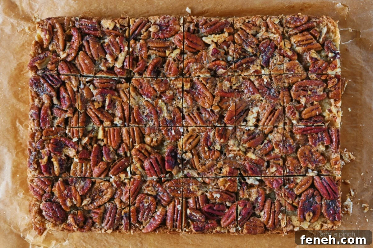 Pecan pie bars on a parchment paper.