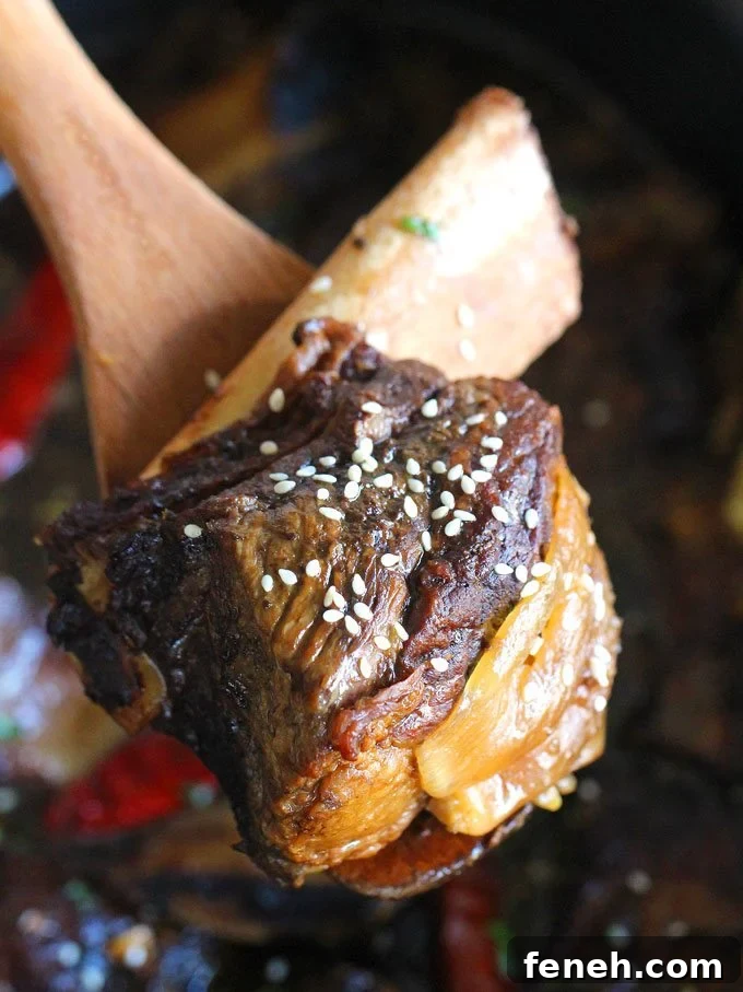 Slow Cooker Asian Short Ribs topped with sesame seeds