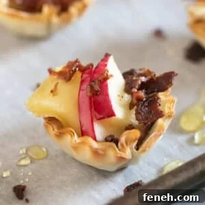 A close up image of a Brie Apple Phyllo Cup on a pan.