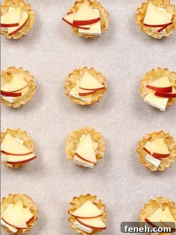 Apples added into each phyllo cup.
