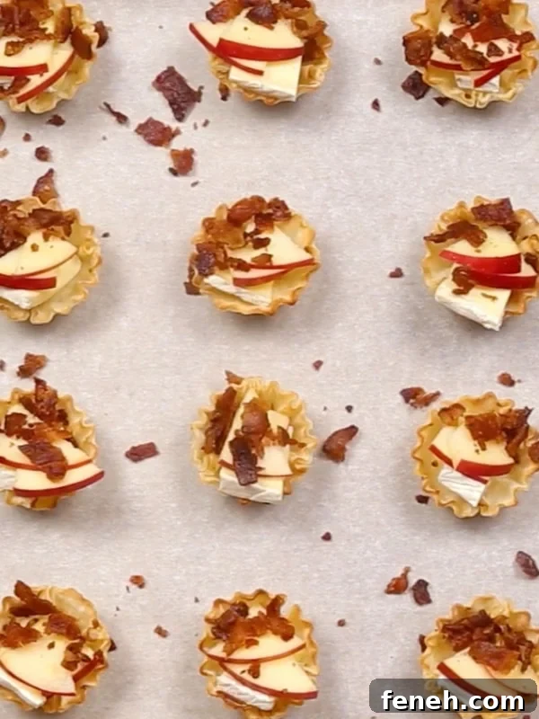 Bacon sprinkled onto the phyllo cups.