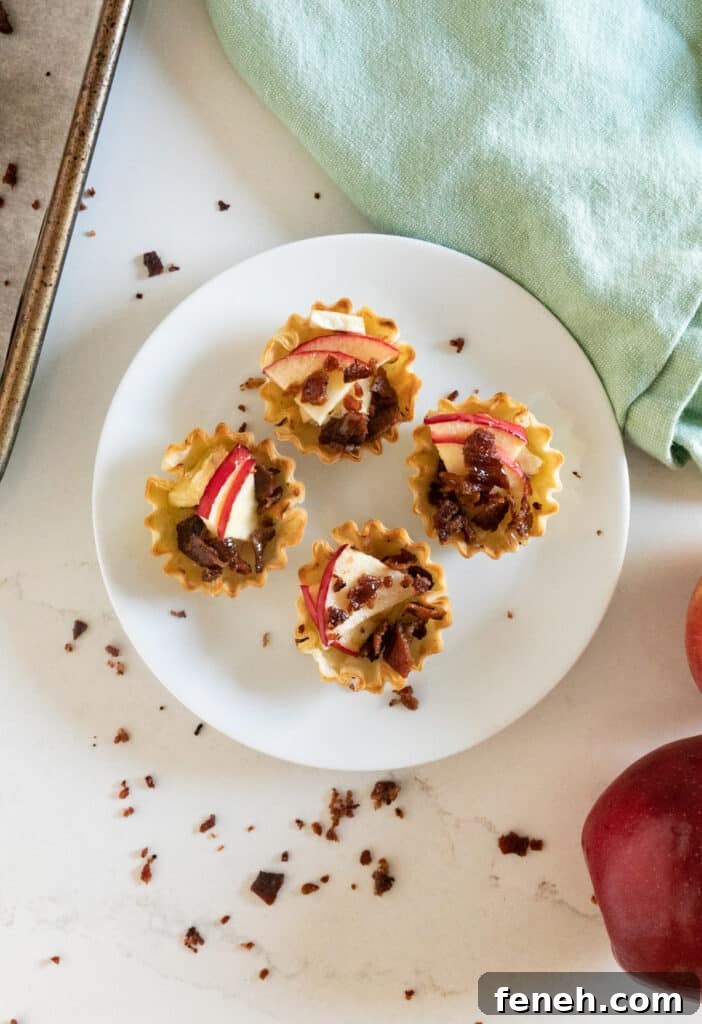 An overhead image of some phyllo cup appetizers on a plate.