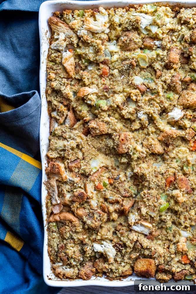 Overhead shot of dressing in white baking dish with blue towel on the side.