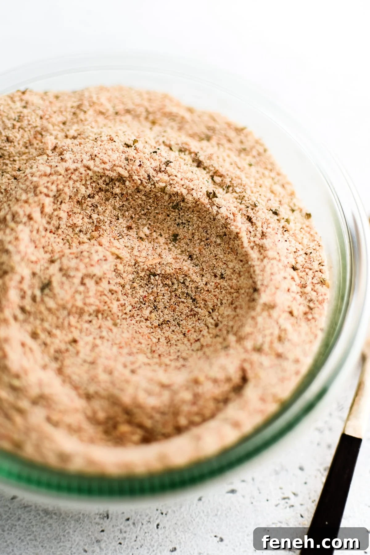 Glass jar filled with homemade Shake and Bake seasoning.
