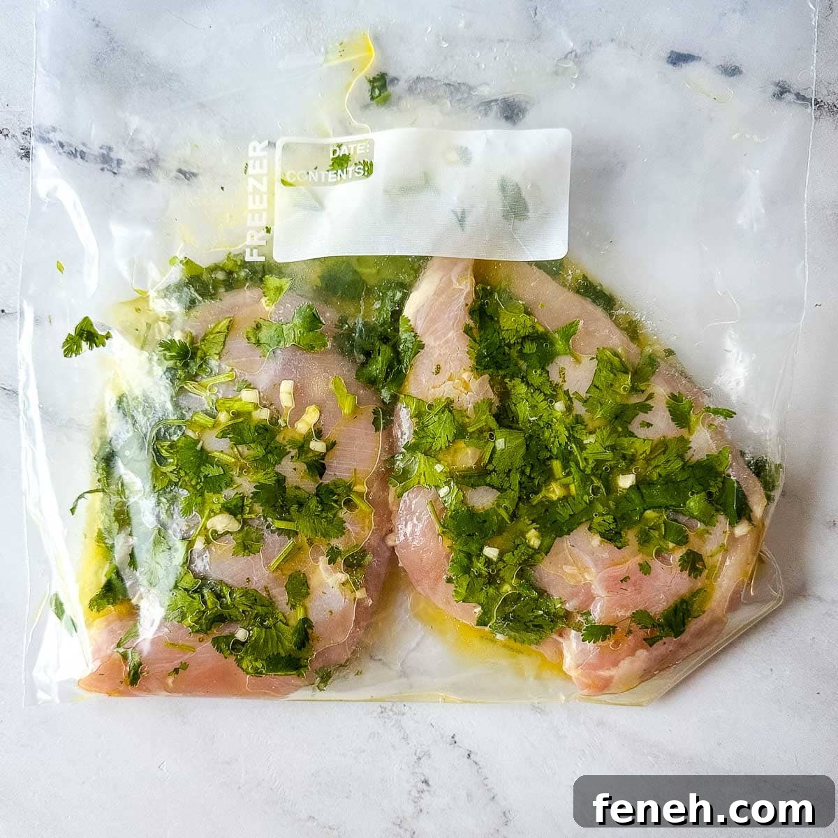 Chicken marinating in lime cilantro marinade.