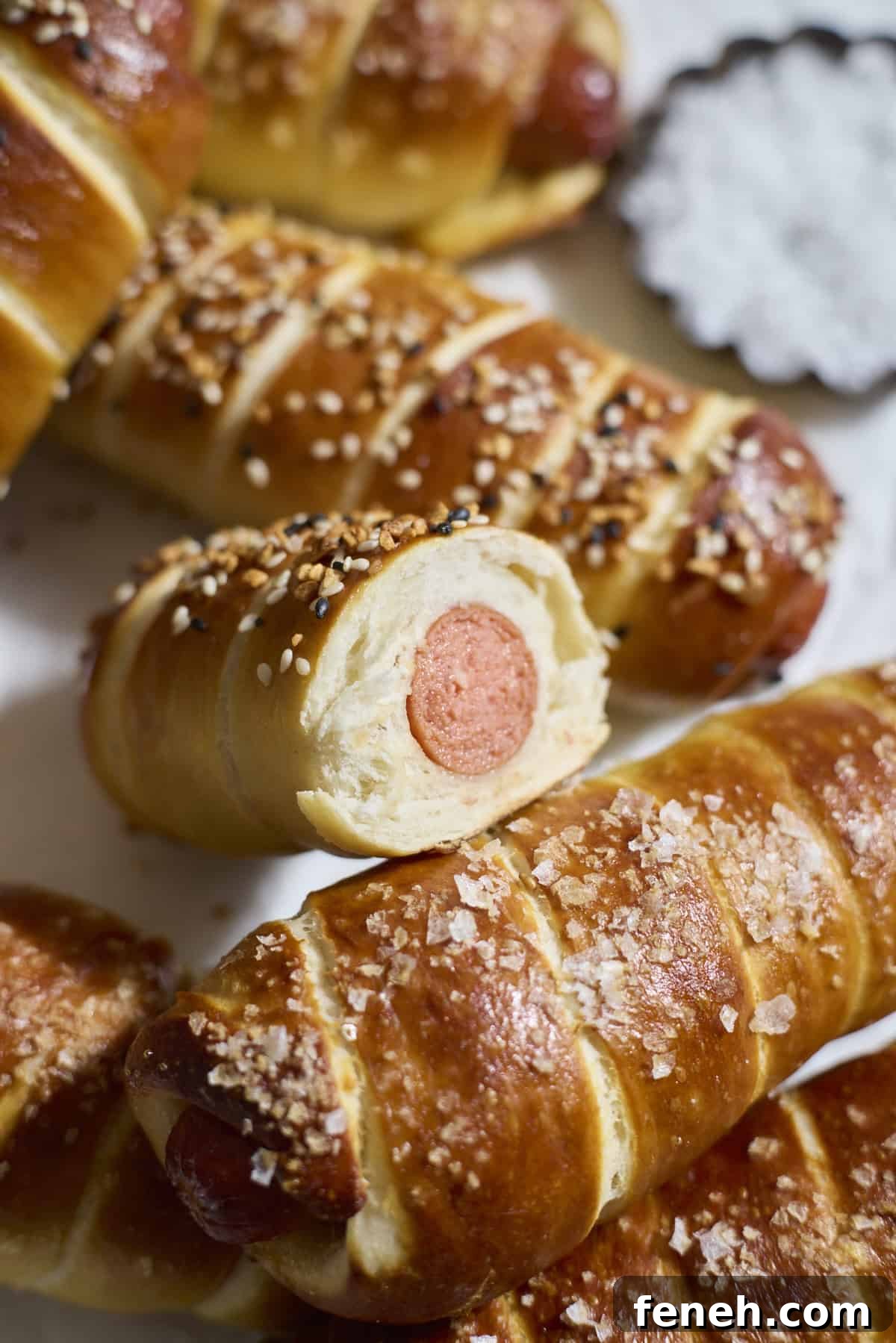 Sourdough Discard Pretzel-Wrapped Hot Dogs in a pile.