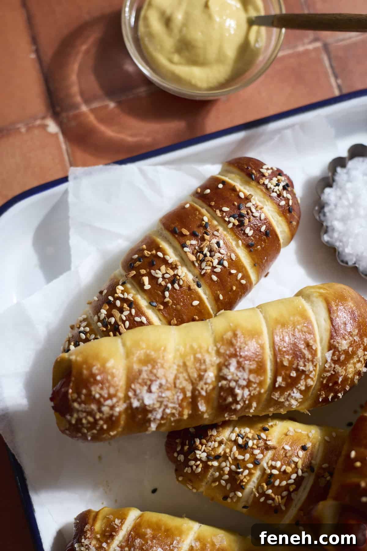 Sourdough Discard Pretzel-Wrapped Hot Dogs on a white tray.