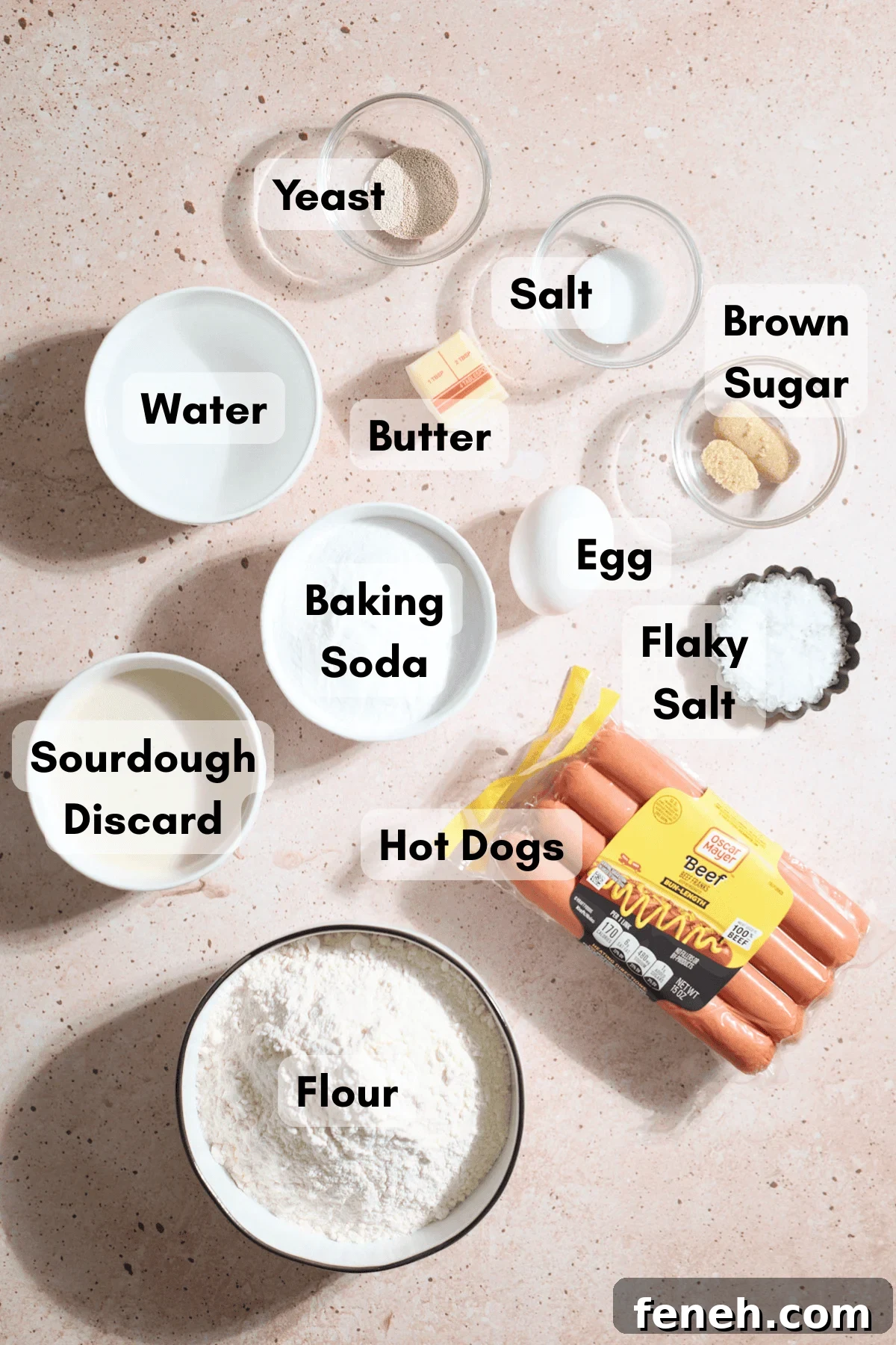 Ingredients for Sourdough Discard Pretzel-Wrapped Hot Dogs in small bowls.