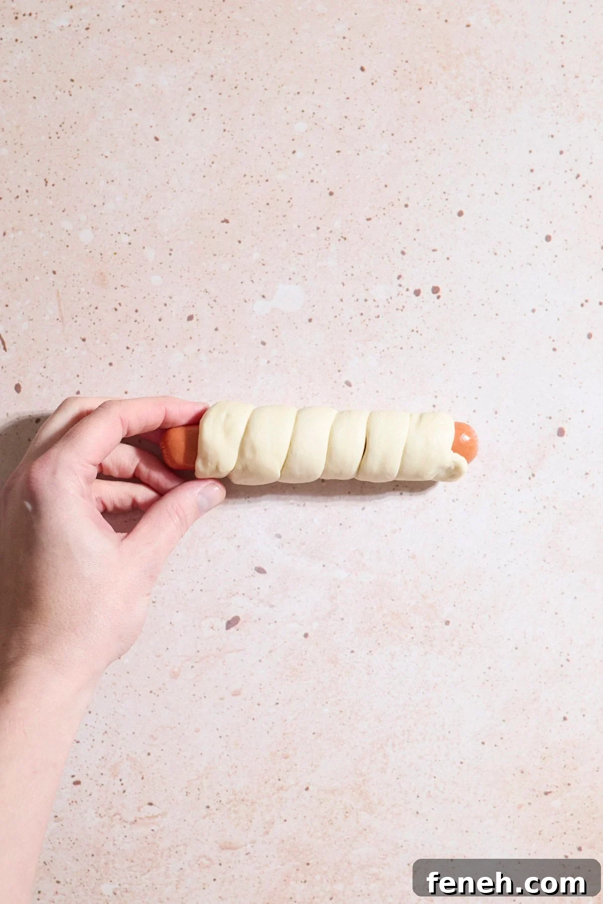 Dough wrapped around the hot dog.