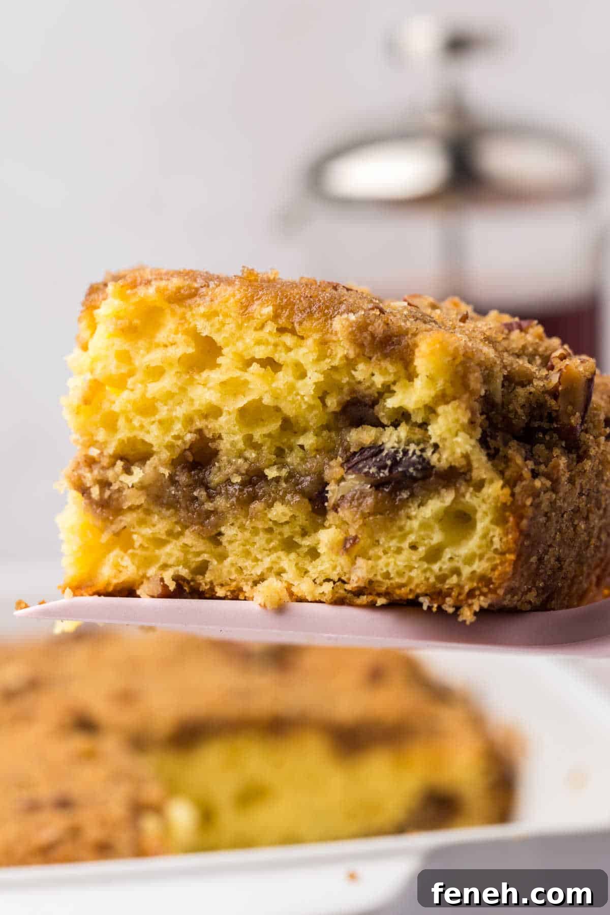 A piece of cake mix coffee cake on a spatula.
