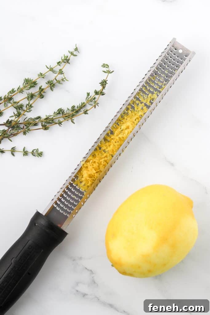 Fresh thyme sprigs, a lemon zester with lemon zest and lemon