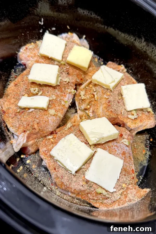 butter and seasoning on chicken