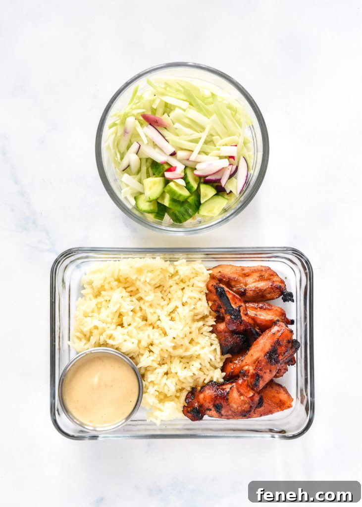 air fryer honey sriracha chicken bowls packed in glass meal prep containers.