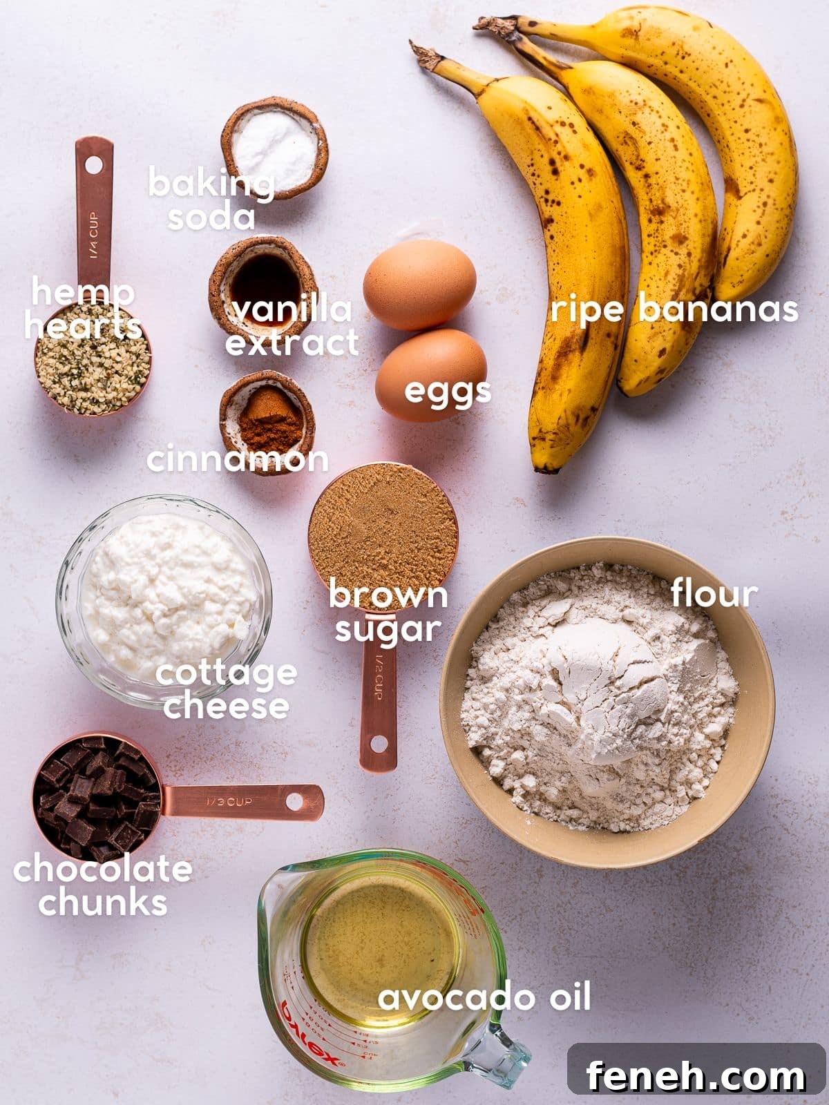 Ingredients for cottage cheese banana bread including ripe bananas, cottage cheese, flour, eggs, brown sugar, and chocolate chunks.