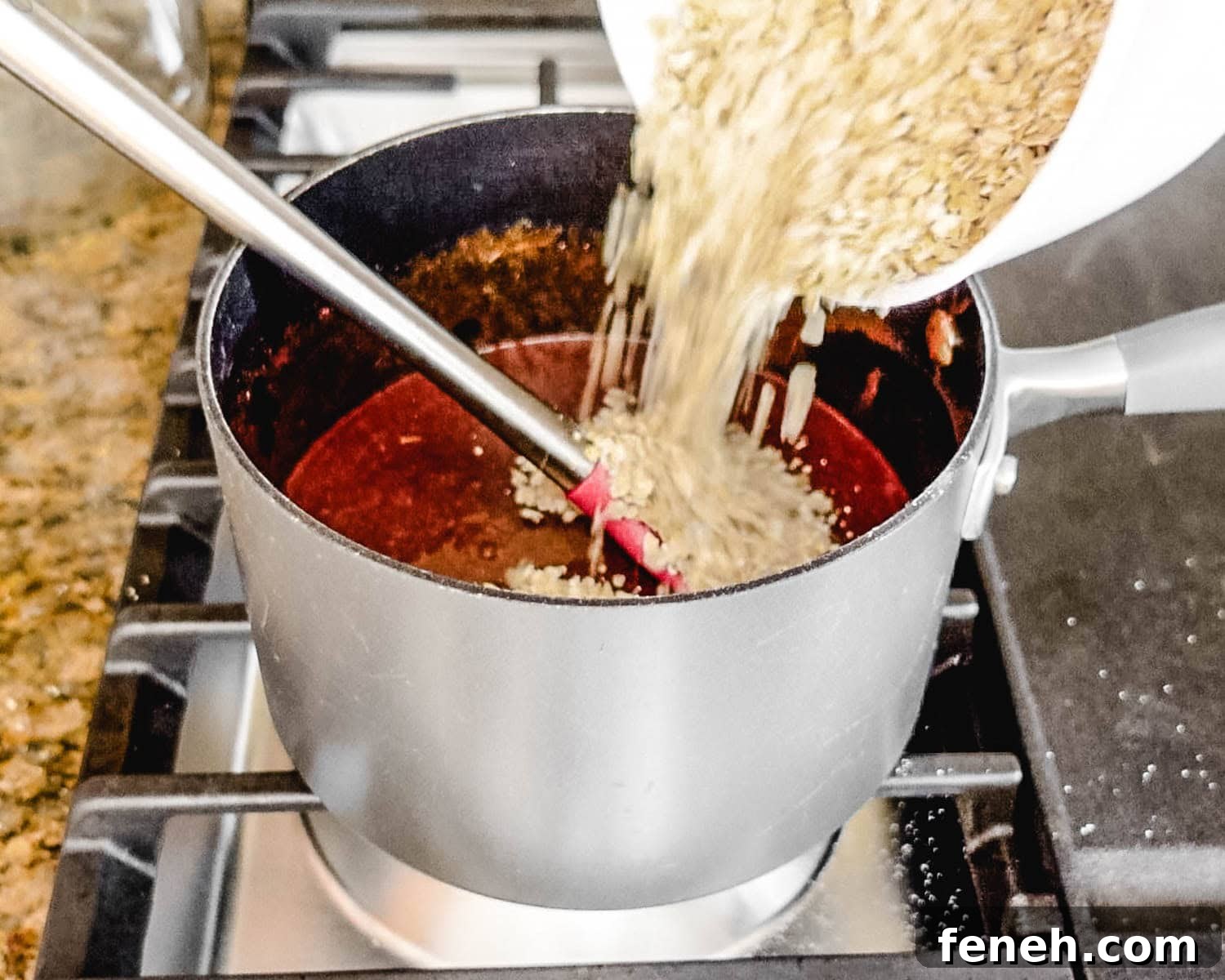 Add the quick cooking oats to the melted mixture.