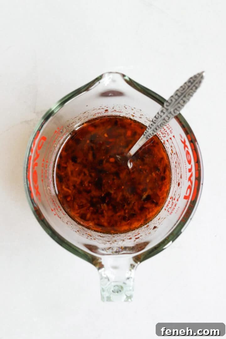 Stir fry sauce stirred and prepared in a glass measuring cup